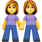 Dwie kobiety trzymając się za ręce
