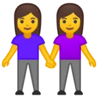 手を繋いでいる2人の女性